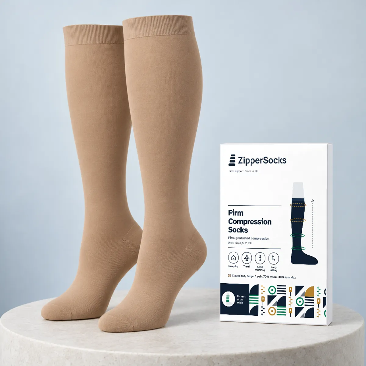Beige firm knee-high compression socks, no zipper, standing beside the ZipperSocks retail box
